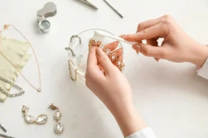 Jewelry laid out on a towel being cleaned at home in Portsmouth
