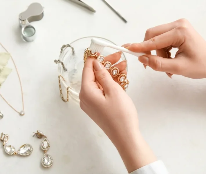 Jewelry laid out on a towel being cleaned at home in Portsmouth